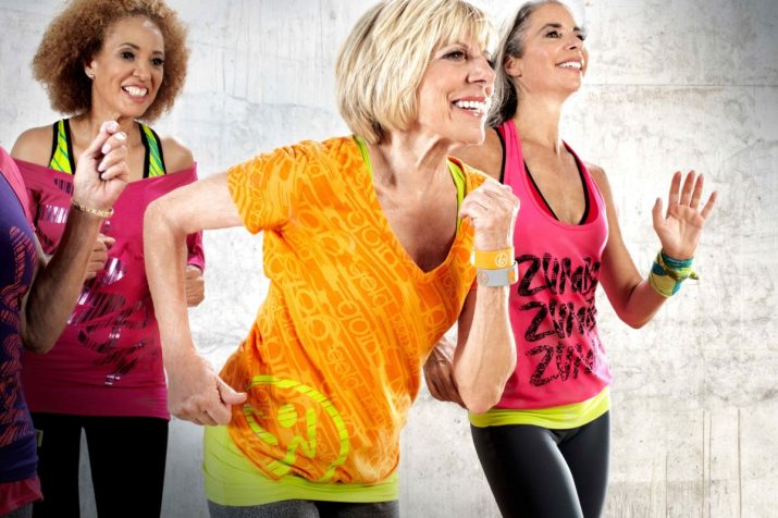 group of fit, active senior women working out in a Zumba class