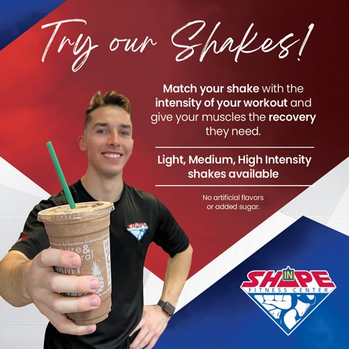 a young man holding a shake